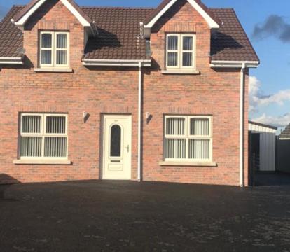 Photo of Slievenagarragh. A house in the garden